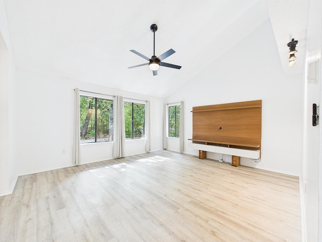 1000 Bay Dr Unit 524, Niceville, FL 32578 - unfurnished living room featuring a ceiling fan, wood finished floors, high vaulted ceiling, and baseboards