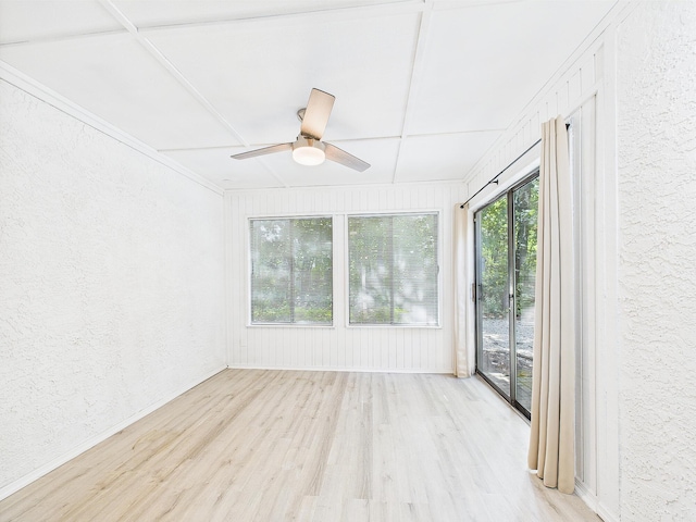 1000 Bay Dr Unit 524, Niceville, FL 32578 - unfurnished sunroom with a textured wall and wood finished floors