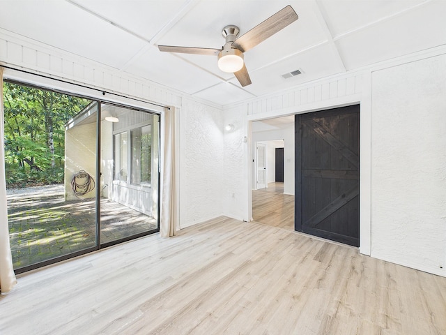 1000 Bay Dr Unit 524, Niceville, FL 32578 - spare room with a textured wall, wood finished floors, a ceiling fan, and coffered ceiling