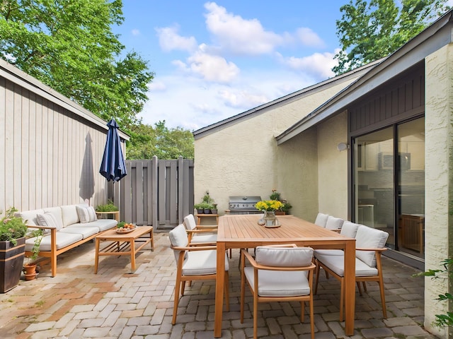 1000 Bay Dr Unit 524, Niceville, FL 32578 - view of patio / terrace featuring a grill, an outdoor hangout area, and outdoor dining space