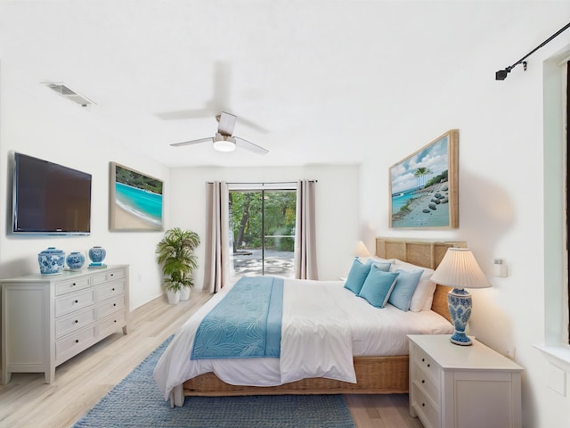 1000 Bay Dr Unit 524, Niceville, FL 32578 - bedroom with access to exterior, light wood-style floors, and ceiling fan