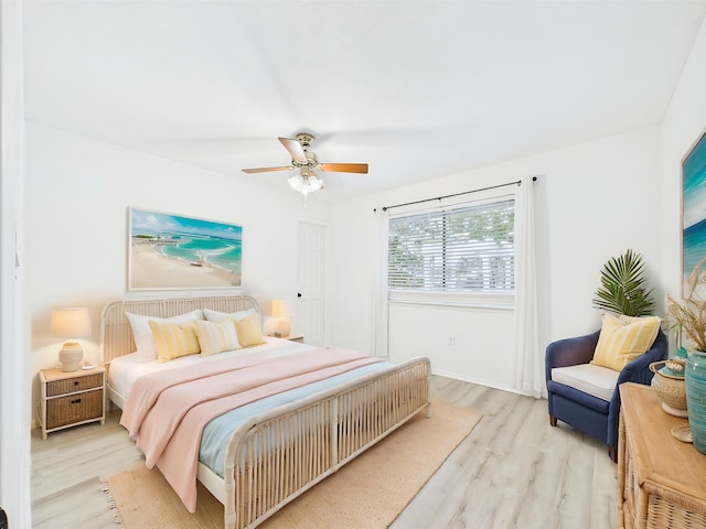 1000 Bay Dr Unit 524, Niceville, FL 32578 - bedroom featuring wood finished floors, a ceiling fan, and baseboards