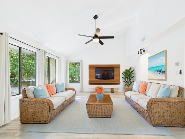 1000 Bay Dr Unit 524, Niceville, FL 32578 - living area with a ceiling fan, wood finished floors, and high vaulted ceiling