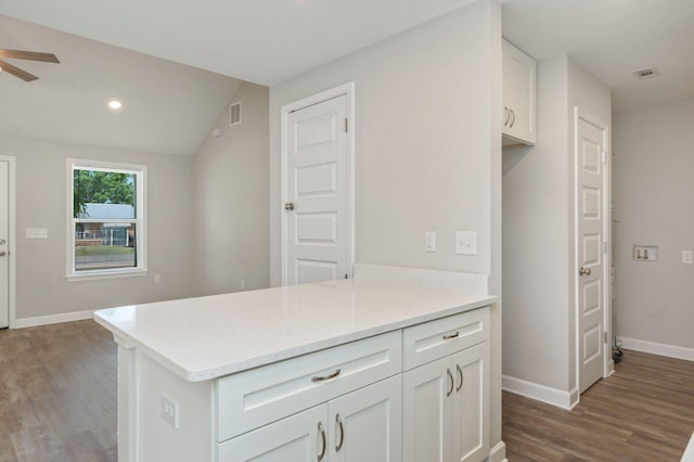 192 S Norwood Rd, Defuniak Springs, FL 32435 - kitchen with dark wood-style flooring, baseboards, white cabinetry, a ceiling fan, and lofted ceiling