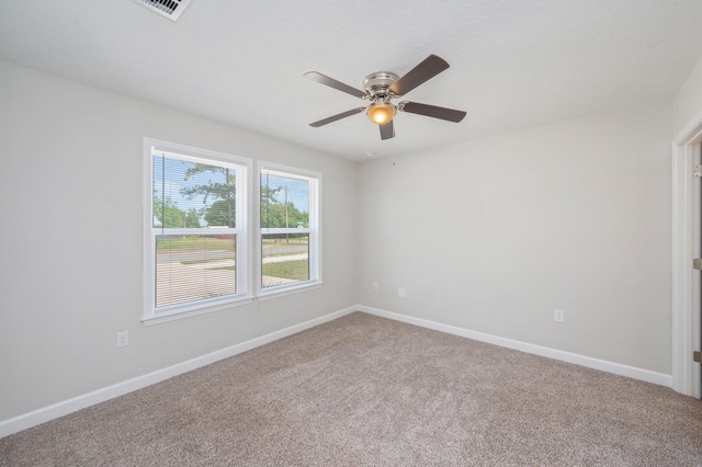 192 S Norwood Rd, Defuniak Springs, FL 32435 - empty room with carpet flooring, a ceiling fan, and baseboards