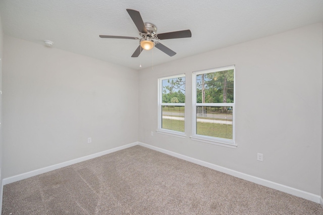 192 S Norwood Rd, Defuniak Springs, FL 32435 - carpeted empty room featuring baseboards, a ceiling fan, and a smoke detector