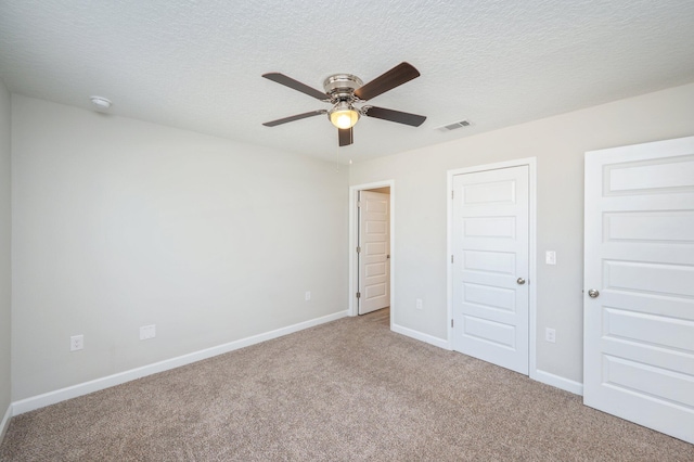 192 S Norwood Rd, Defuniak Springs, FL 32435 - unfurnished bedroom featuring carpet floors, baseboards, a textured ceiling, and a ceiling fan