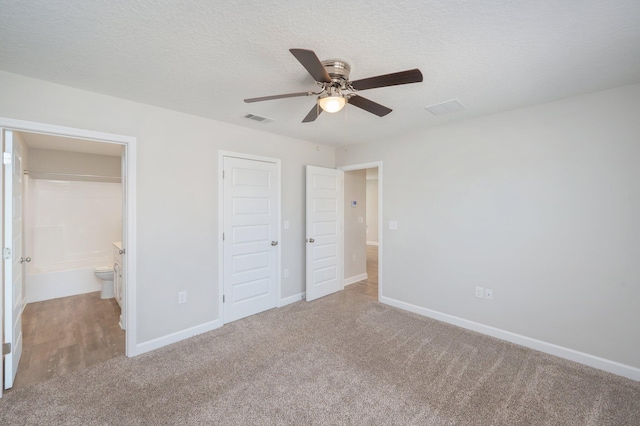 192 S Norwood Rd, Defuniak Springs, FL 32435 - unfurnished bedroom featuring carpet flooring, baseboards, a textured ceiling, a closet, and ceiling fan