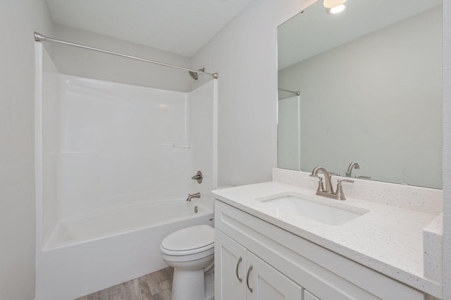 192 S Norwood Rd, Defuniak Springs, FL 32435 - full bath with wood finished floors, toilet, tub / shower combination, and vanity