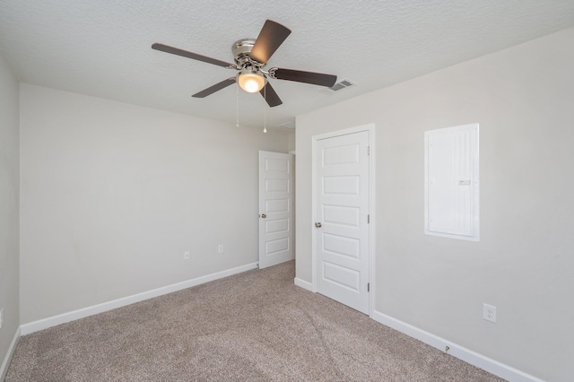 192 S Norwood Rd, Defuniak Springs, FL 32435 - unfurnished bedroom featuring carpet flooring, baseboards, a textured ceiling, and ceiling fan
