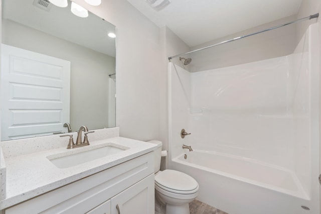 192 S Norwood Rd, Defuniak Springs, FL 32435 - bathroom with toilet, wood finished floors, vanity, and shower / tub combination