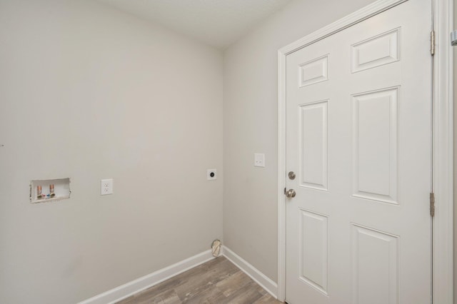 192 S Norwood Rd, Defuniak Springs, FL 32435 - laundry room with hookup for an electric dryer, baseboards, wood finished floors, and hookup for a washing machine