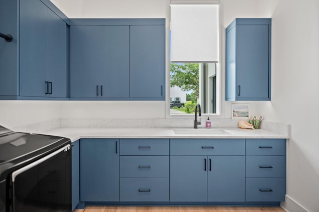 3502 Burnt Pine Ln, Miramar Beach, FL 32550 - kitchen with blue cabinets, range, and light countertops