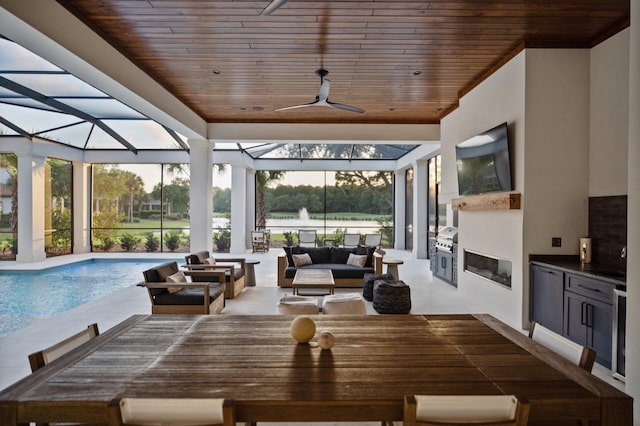 3502 Burnt Pine Ln, Miramar Beach, FL 32550 - view of patio / terrace featuring exterior kitchen, outdoor dining area, an outdoor pool, and ceiling fan