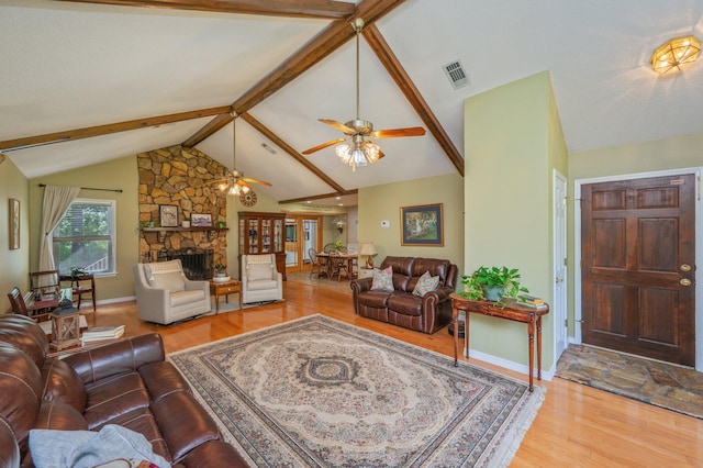 6087 Terrace Ln, Crestview, FL 32536 - living room with wood finished floors, a stone fireplace, and ceiling fan