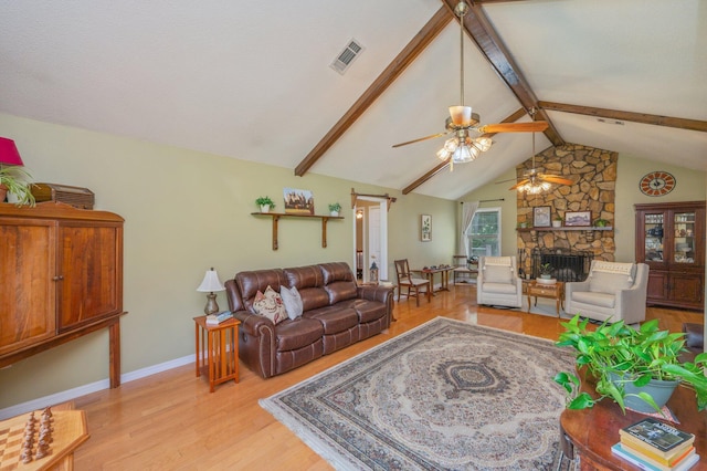 6087 Terrace Ln, Crestview, FL 32536 - living area featuring ceiling fan, light wood-style flooring, a fireplace, and baseboards