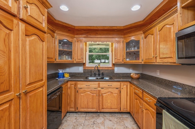 6087 Terrace Ln, Crestview, FL 32536 - kitchen featuring a sink, black appliances, glass insert cabinets, brown cabinets, and recessed lighting