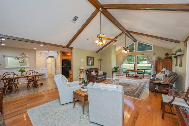 6087 Terrace Ln, Crestview, FL 32536 - living room featuring wood finished floors, ceiling fan, a wainscoted wall, a chandelier, and beam ceiling