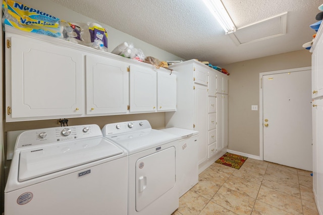 6087 Terrace Ln, Crestview, FL 32536 - washroom with washing machine and dryer, cabinet space, attic access, and a textured ceiling