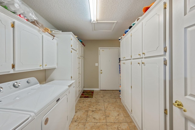 6087 Terrace Ln, Crestview, FL 32536 - washroom featuring washer and clothes dryer, cabinet space, attic access, a textured ceiling, and baseboards
