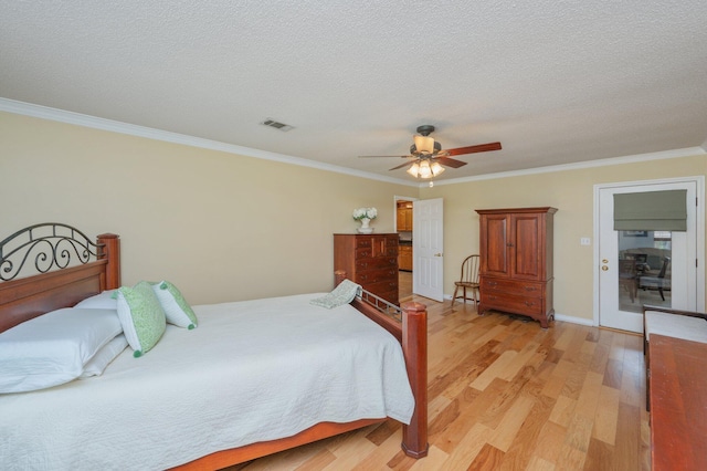 6087 Terrace Ln, Crestview, FL 32536 - bedroom with light wood-style flooring, ornamental molding, a textured ceiling, ceiling fan, and baseboards