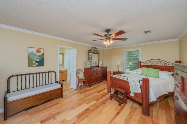 6087 Terrace Ln, Crestview, FL 32536 - bedroom with light wood-type flooring, crown molding, a textured ceiling, a ceiling fan, and ensuite bath