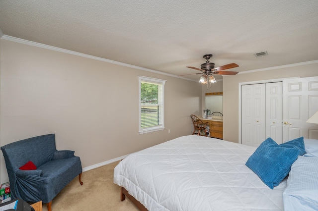 6087 Terrace Ln, Crestview, FL 32536 - bedroom featuring crown molding, carpet floors, a closet, baseboards, and a ceiling fan