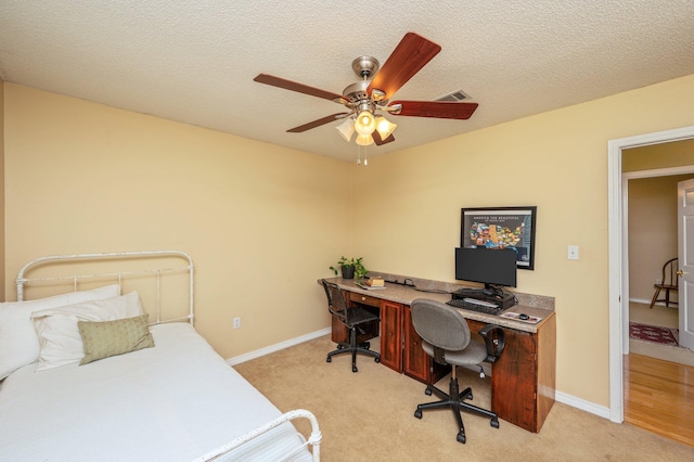 6087 Terrace Ln, Crestview, FL 32536 - bedroom featuring light carpet, an office area, baseboards, and a textured ceiling