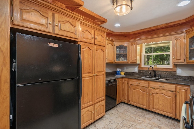 6087 Terrace Ln, Crestview, FL 32536 - kitchen featuring black appliances, a sink, glass insert cabinets, brown cabinets, and dark stone countertops