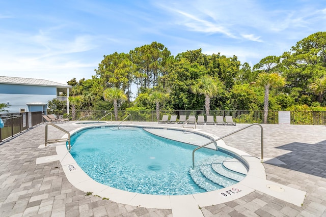 70 Martha S Ln # 2-101, Santa Rosa Beach, FL 32459 - community pool with view of wooded area and a patio