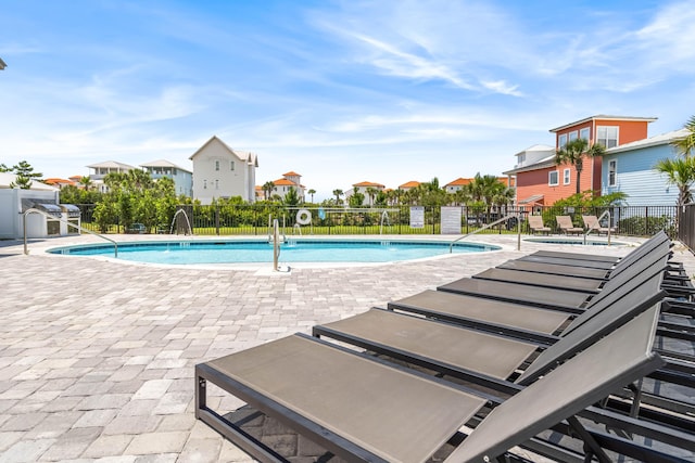 70 Martha S Ln # 2-101, Santa Rosa Beach, FL 32459 - community pool with a patio area and a residential view