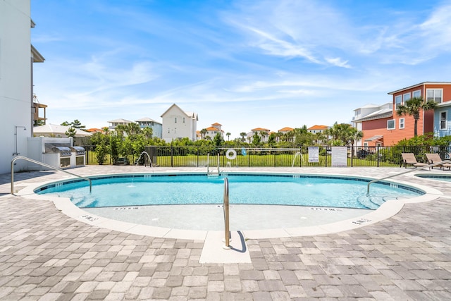70 Martha S Ln # 2-101, Santa Rosa Beach, FL 32459 - community pool featuring a residential view and a patio