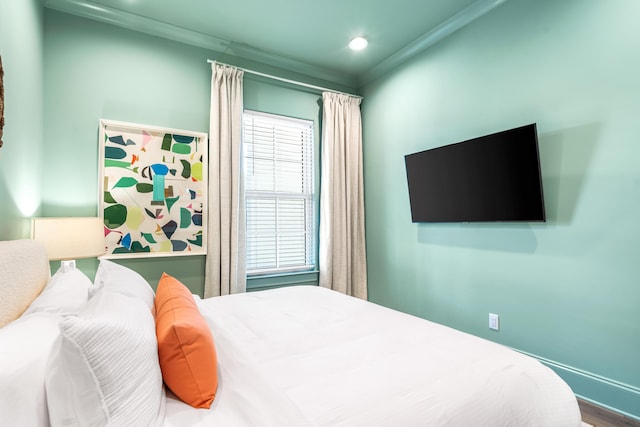 70 Martha S Ln # 2-101, Santa Rosa Beach, FL 32459 - bedroom featuring ornamental molding, recessed lighting, wood finished floors, and baseboards