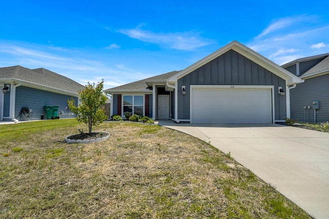 262 Bayou Bend Ln, Panama City, FL 32404 - ranch-style home featuring an attached garage, driveway, board and batten siding, and a front lawn