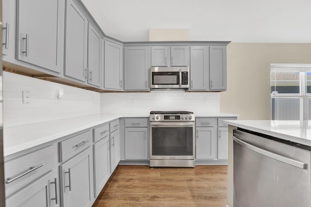 262 Bayou Bend Ln, Panama City, FL 32404 - kitchen featuring appliances with stainless steel finishes, gray cabinets, light countertops, and tasteful backsplash
