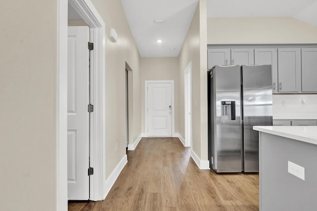 262 Bayou Bend Ln, Panama City, FL 32404 - kitchen featuring stainless steel refrigerator with ice dispenser, gray cabinets, light countertops, light wood-style floors, and recessed lighting