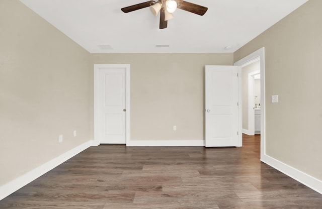 262 Bayou Bend Ln, Panama City, FL 32404 - unfurnished bedroom featuring wood finished floors, baseboards, and ceiling fan