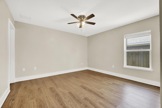 262 Bayou Bend Ln, Panama City, FL 32404 - unfurnished room with a ceiling fan, wood finished floors, and baseboards
