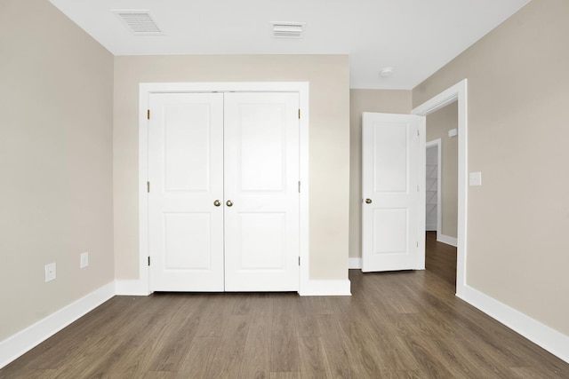 262 Bayou Bend Ln, Panama City, FL 32404 - unfurnished bedroom featuring wood finished floors, baseboards, and a closet