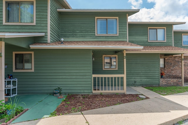 115 NE Hughes St Unit B3, Fort Walton Beach, FL 32548 - view of side of home with roof with shingles