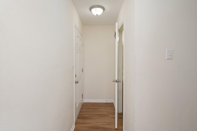 115 NE Hughes St Unit B3, Fort Walton Beach, FL 32548 - corridor with wood finished floors and baseboards