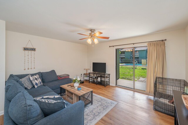 115 NE Hughes St Unit B3, Fort Walton Beach, FL 32548 - living room featuring wood finished floors, ceiling fan, and baseboards