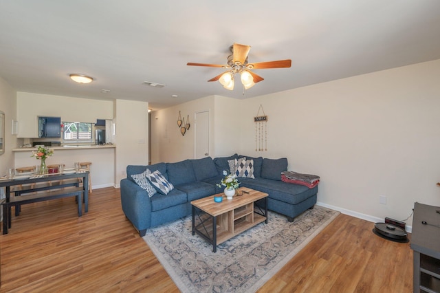115 NE Hughes St Unit B3, Fort Walton Beach, FL 32548 - living room with wood finished floors, a ceiling fan, and baseboards