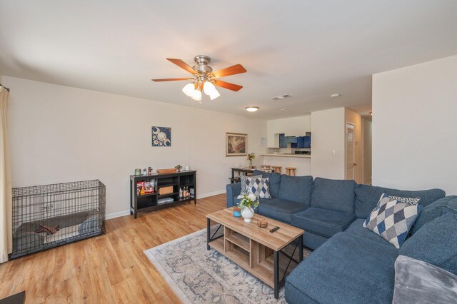 115 NE Hughes St Unit B3, Fort Walton Beach, FL 32548 - living area featuring light wood-type flooring, a ceiling fan, and baseboards