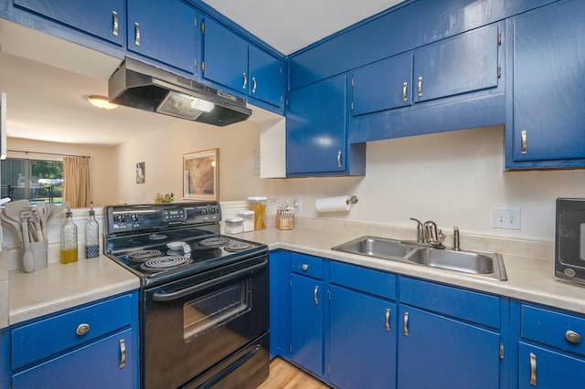115 NE Hughes St Unit B3, Fort Walton Beach, FL 32548 - kitchen featuring black appliances, under cabinet range hood, a sink, and blue cabinets