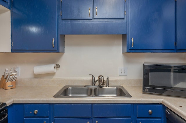 115 NE Hughes St Unit B3, Fort Walton Beach, FL 32548 - kitchen with black appliances, a sink, blue cabinetry, and light countertops