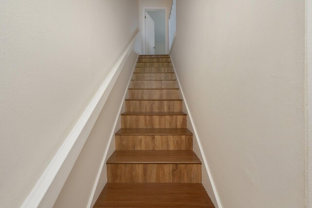 115 NE Hughes St Unit B3, Fort Walton Beach, FL 32548 - stairway featuring wood finished floors