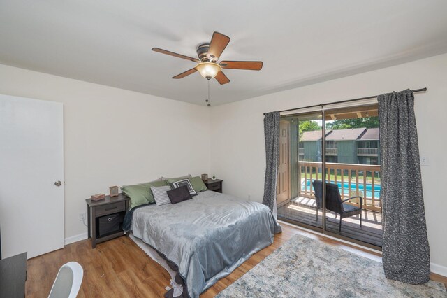 115 NE Hughes St Unit B3, Fort Walton Beach, FL 32548 - bedroom with access to outside, wood finished floors, a ceiling fan, and baseboards