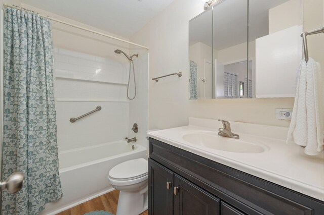 115 NE Hughes St Unit B3, Fort Walton Beach, FL 32548 - bathroom featuring shower / tub combo, toilet, vanity, and wood finished floors