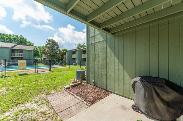 115 NE Hughes St Unit B3, Fort Walton Beach, FL 32548 - view of yard featuring central AC unit and a patio